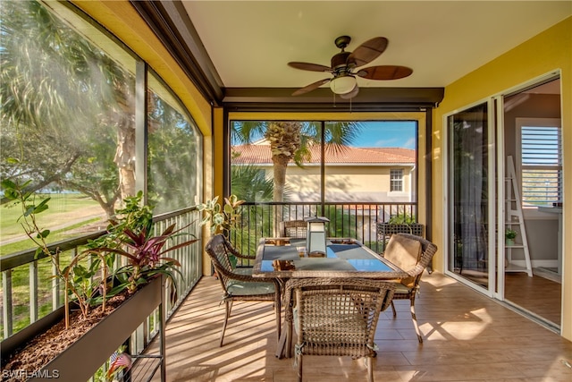 sunroom / solarium with ceiling fan and a wealth of natural light