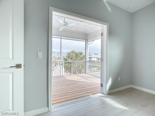 entryway with light hardwood / wood-style floors and ceiling fan