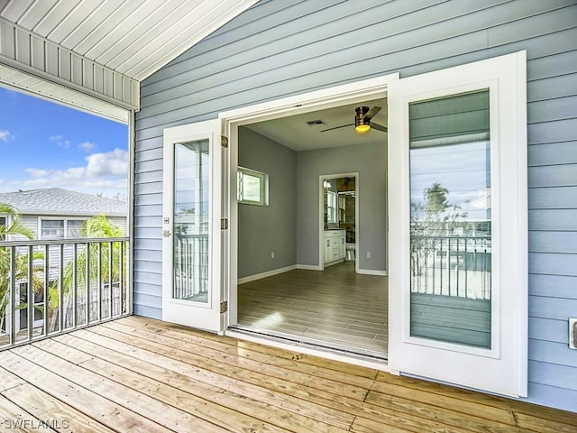 exterior space with ceiling fan