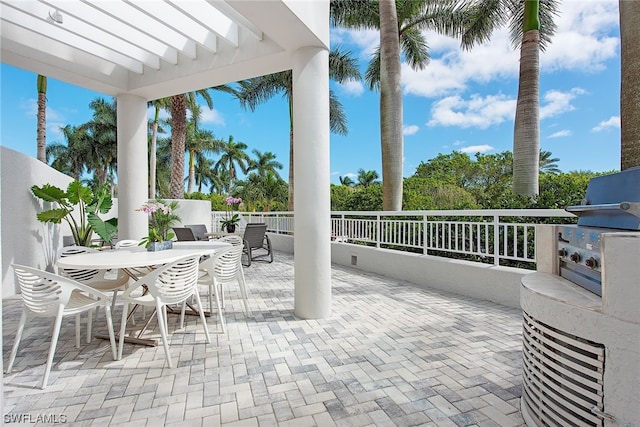 view of patio featuring a pergola, grilling area, and exterior kitchen