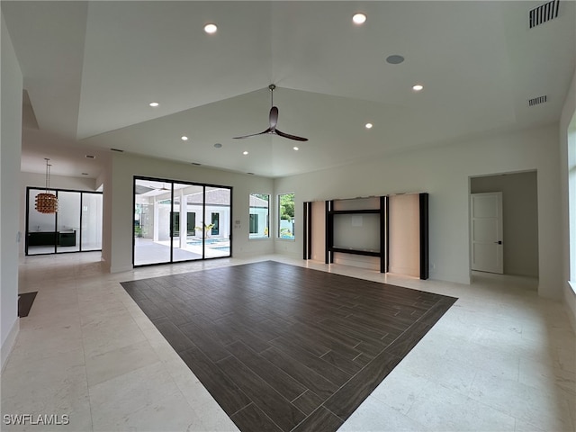 tiled living room with ceiling fan