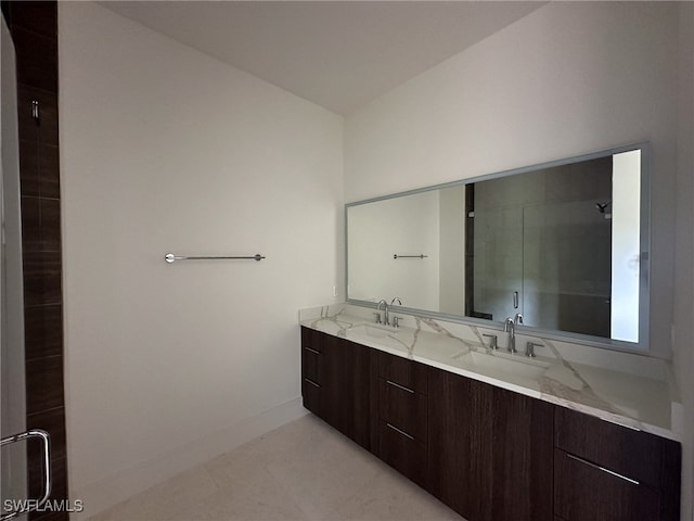 bathroom featuring vanity, tile patterned flooring, and a shower with door