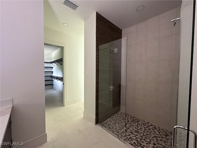 bathroom with vanity and an enclosed shower