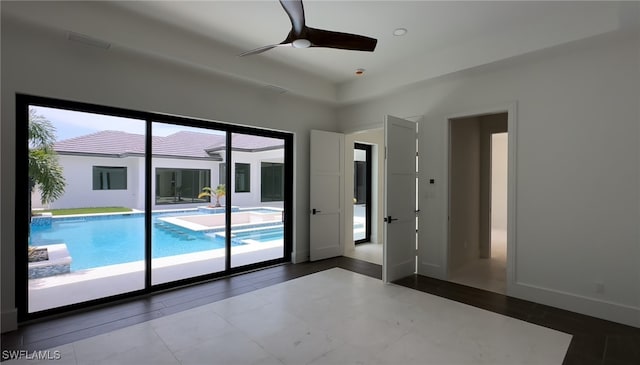 interior space featuring ceiling fan and a healthy amount of sunlight