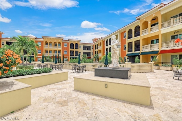 surrounding community featuring a patio area