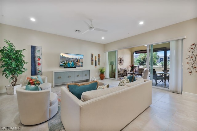 living room featuring light tile patterned floors and ceiling fan