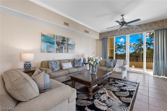 living room with ceiling fan, ornamental molding, and tile patterned floors