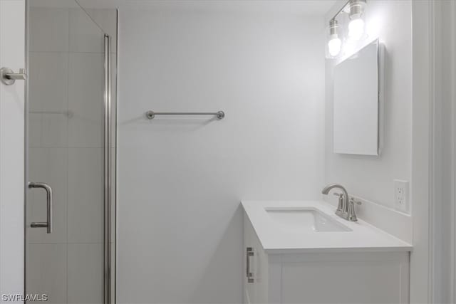 bathroom with vanity and an enclosed shower