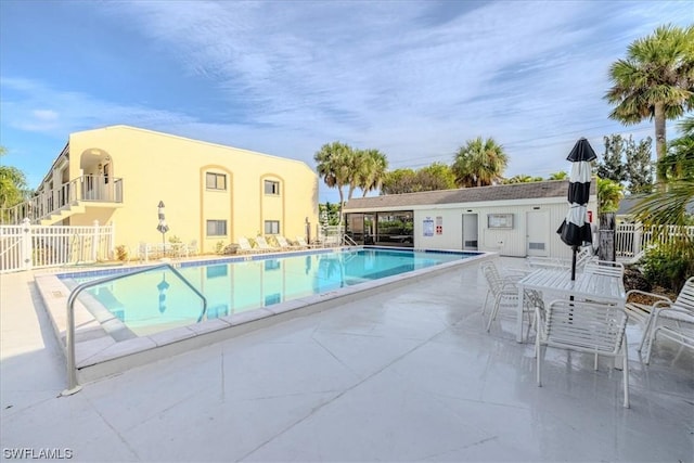 view of swimming pool featuring a patio area