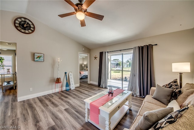 living room with dark wood-type flooring, lofted ceiling, and ceiling fan