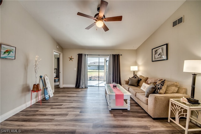 living room with vaulted ceiling, ceiling fan, and dark hardwood / wood-style flooring