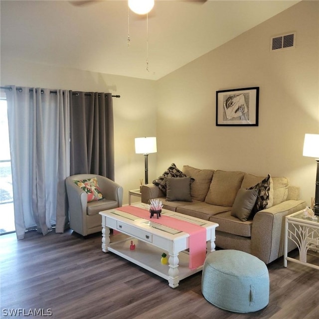 living room featuring vaulted ceiling, ceiling fan, and dark hardwood / wood-style flooring