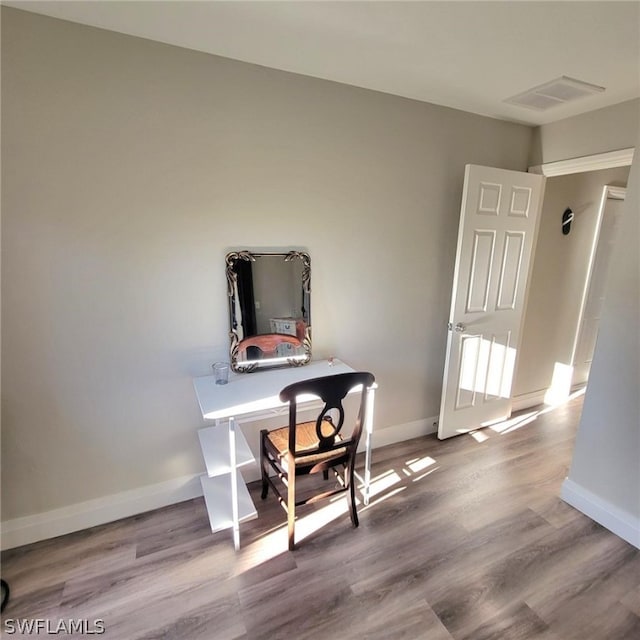 office space with light wood-type flooring