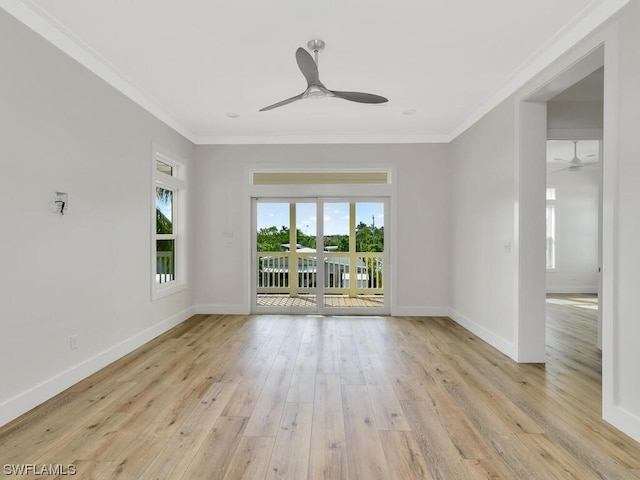 spare room with crown molding, ceiling fan, and light hardwood / wood-style flooring