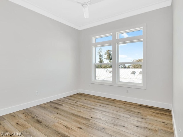 unfurnished room with crown molding and light hardwood / wood-style flooring