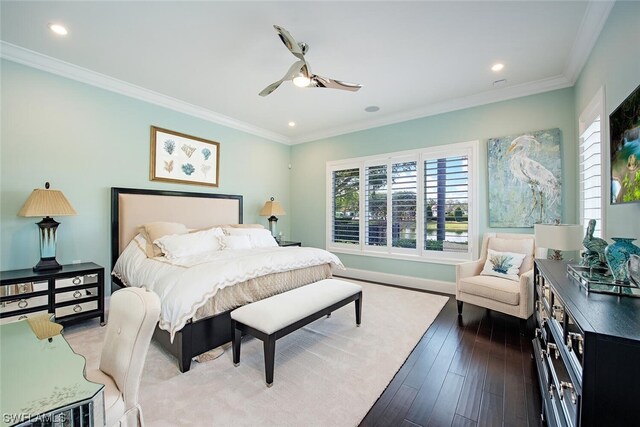 bedroom featuring crown molding, hardwood / wood-style floors, and ceiling fan