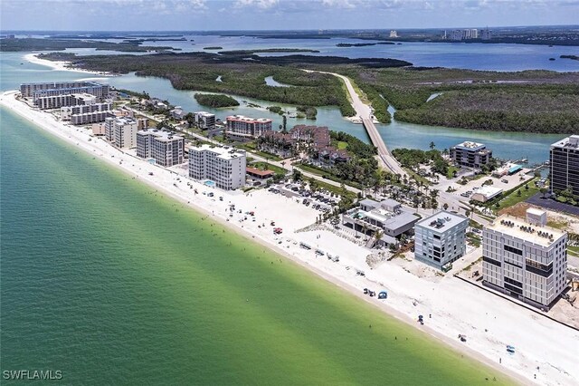 bird's eye view featuring a view of the beach and a water view