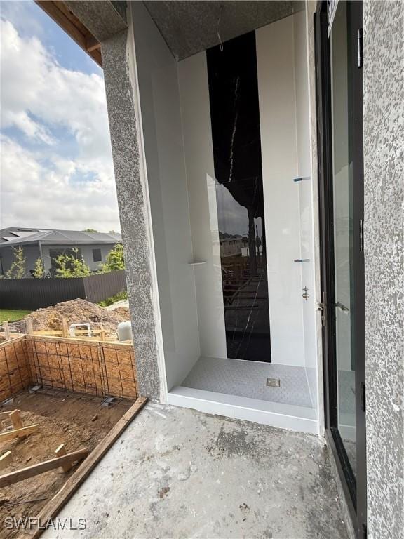 doorway to property with stucco siding