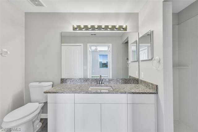 bathroom with toilet and vanity