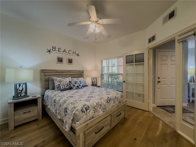 bedroom featuring ceiling fan and hardwood / wood-style flooring