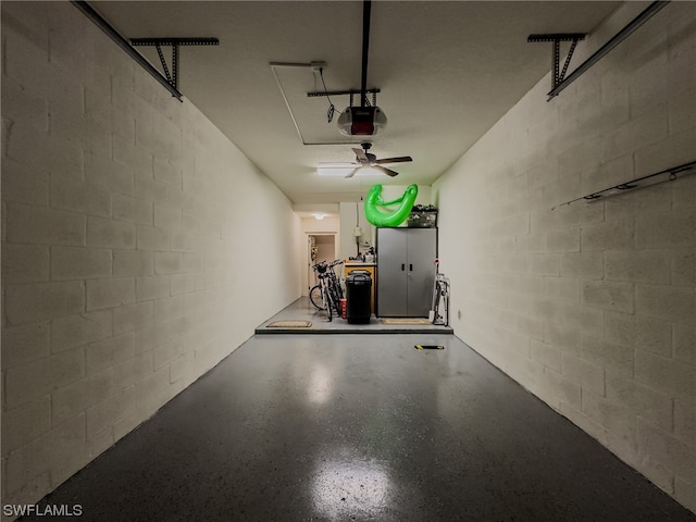 garage featuring a garage door opener and ceiling fan