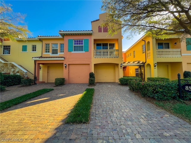 view of front of house with a balcony and a garage