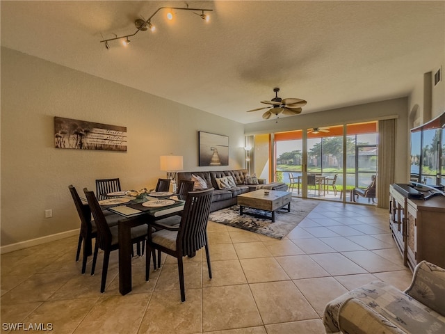 dining area featuring plenty of natural light, light tile flooring, and ceiling fan