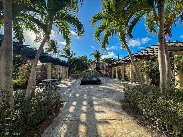 view of home's community featuring a pergola and a patio area