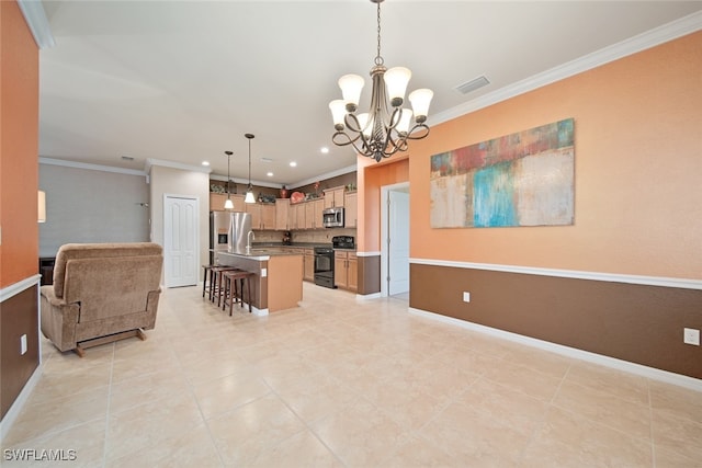 kitchen with a center island, a notable chandelier, decorative light fixtures, a breakfast bar area, and appliances with stainless steel finishes