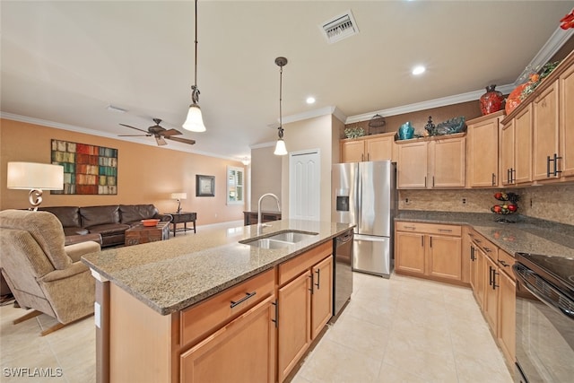 kitchen featuring sink, light stone counters, a kitchen island with sink, black appliances, and ornamental molding