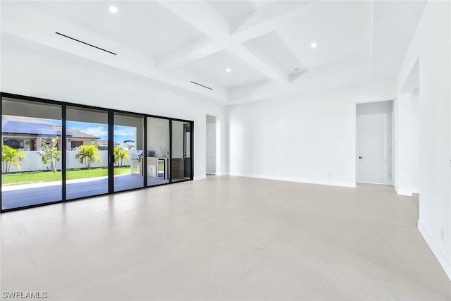 tiled spare room featuring coffered ceiling and beamed ceiling