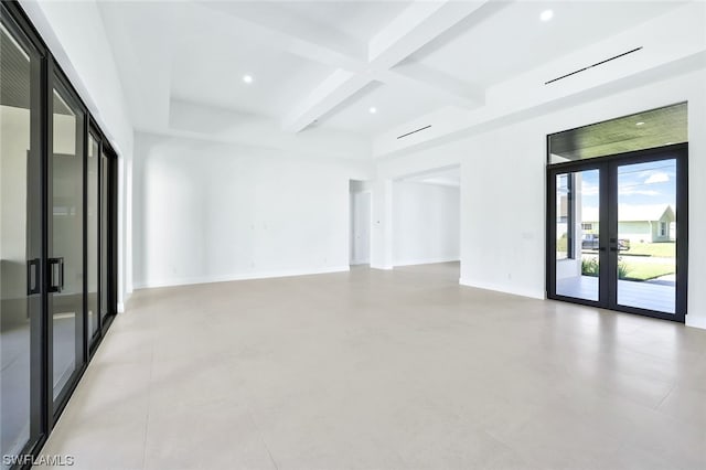 unfurnished room featuring light tile floors, coffered ceiling, beam ceiling, and french doors