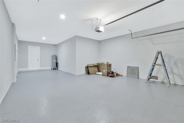 garage with electric water heater and a garage door opener