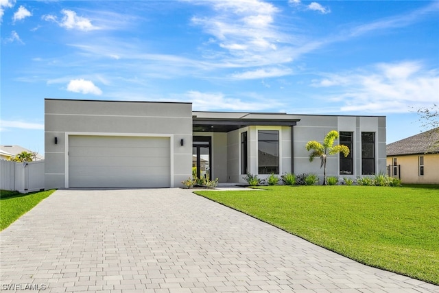 modern home with a front lawn and a garage