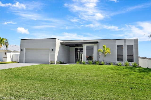 modern home featuring a front lawn and a garage