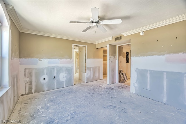 empty room with ornamental molding and ceiling fan