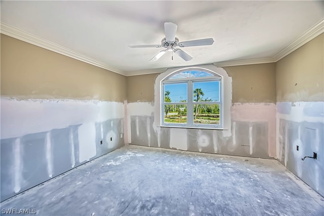 empty room featuring crown molding and ceiling fan