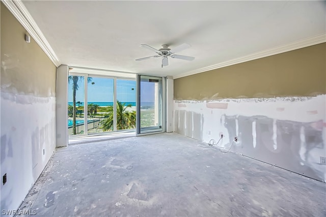 empty room with ceiling fan, crown molding, and a water view