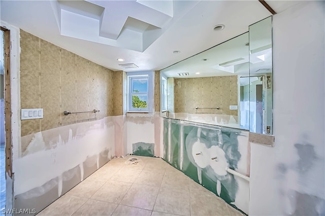 bathroom featuring tile walls and tile floors