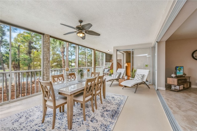 sunroom / solarium with ceiling fan and a wealth of natural light