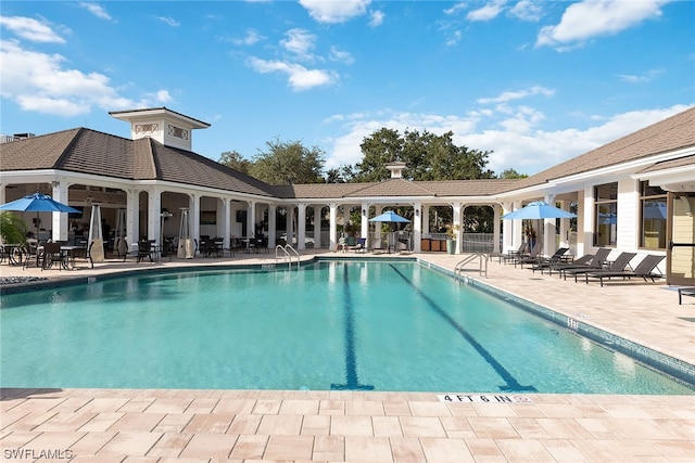 view of swimming pool featuring a patio