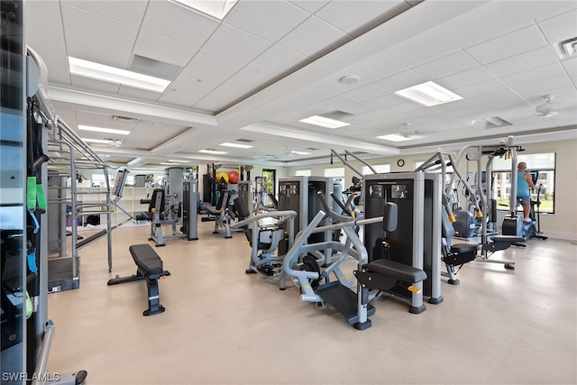 exercise room featuring a drop ceiling