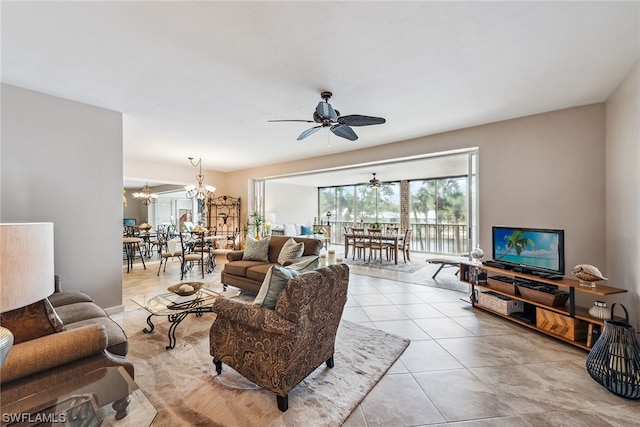 living room featuring ceiling fan with notable chandelier and light tile floors