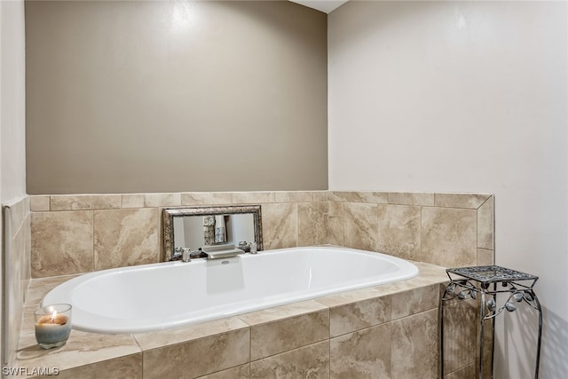 bathroom featuring tiled tub