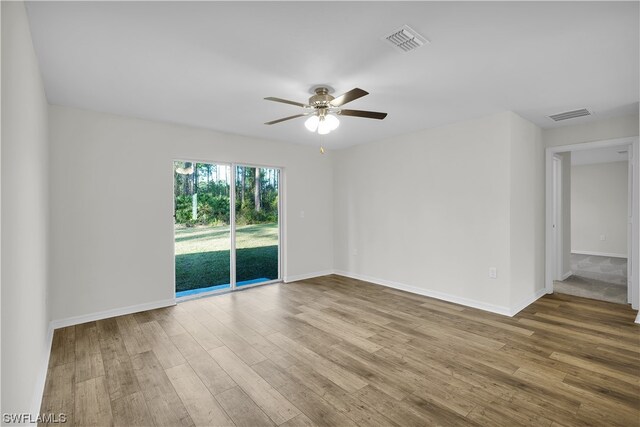 unfurnished room with light hardwood / wood-style floors and ceiling fan