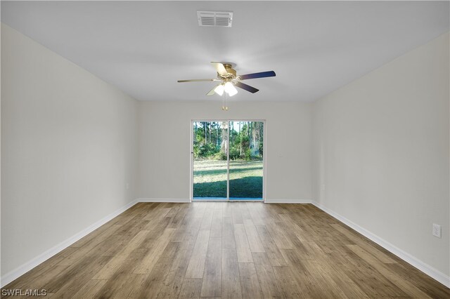 unfurnished room with ceiling fan and light hardwood / wood-style flooring