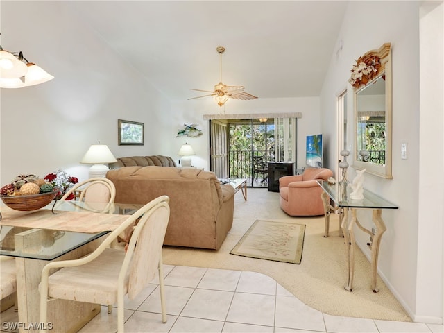 living room with vaulted ceiling, light tile patterned floors, and ceiling fan