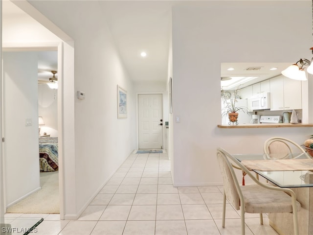 corridor with light tile patterned flooring