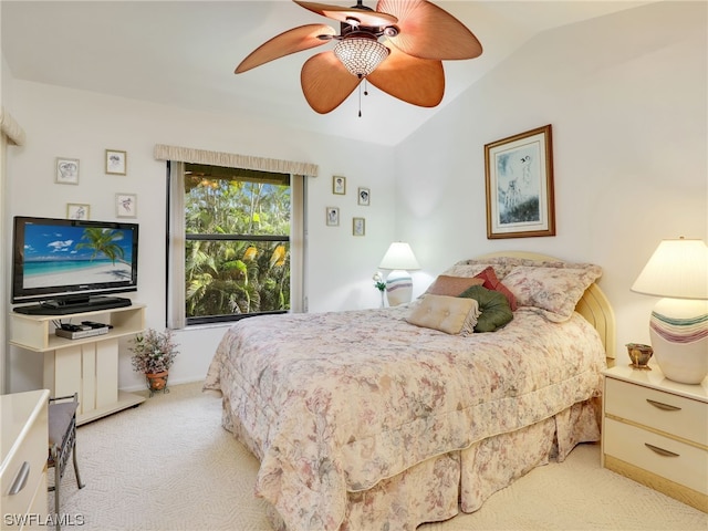 bedroom featuring lofted ceiling, light carpet, and ceiling fan