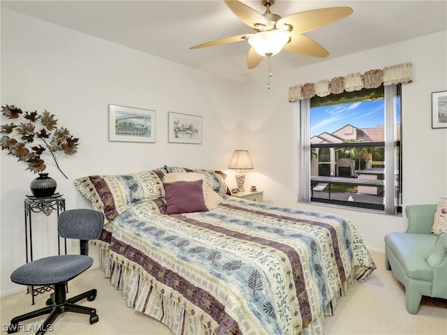 bedroom with ceiling fan and carpet flooring